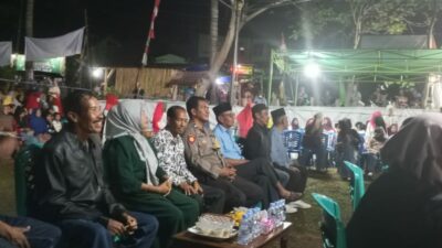 Bhabinkamtibmas Bunga Eja Amankan Perayaan HUT Desa ke-15, Warga Diimbau Kunci Ganda Kendaraan