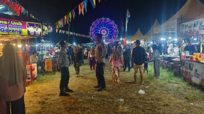 Polres Loteng Amankan Festival Pasar Malam Rona-Rona di Lapangan Peseng