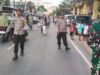Personel Polsek Woha Menggelar Pengamanan dan Pengawalan Pawai Ta’aruf Pembukaan MTQ Tingkat Kecamatan Woha ke-58